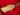 Guitar headstock with tuning pegs on a red background