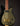 Black and gold electric guitar on a dark background