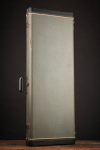 Vintage-style guitar case on a dark background