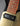 Close-up of a guitar's neck and pickguard with a dark background