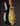 Guitar with black and gold finish on a dark background