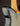 Black and gold electric guitar on a dark background, close up 