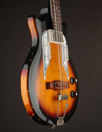 bass guitar with a sunburst finish on a dark background