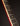 Close-up of a guitar neck against a black background