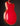 Red electric guitar on a black background