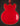 Red electric guitar body on a dark background