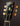 Gibson guitar headstock with tuning pegs on a dark background