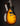 Electric guitar with a sunburst finish on a black background