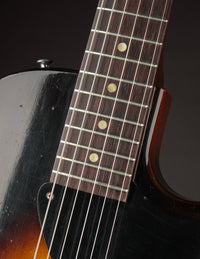 Close-up of a guitar's fretboard