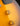 Close-up of a sunburst electric guitar with control knobs.