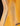 Close-up of a guitar's wooden body with visible grain and finish.