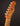 Close-up of a Fender Telecaster guitar headstock on a dark background