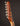 Close-up of a guitar headstock on a dark background