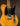 Vintage electric guitar with a blonde finish on a dark background
