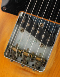 Close-up of a guitar's bridge and strings