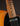 Close-up of a guitar's neck against a dark background