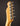 Close-up of a guitar headstock with tuning pegs on a dark background