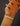 Close-up of a guitar's headstock with tuning pegs and strings.
