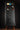 Black Fender guitar case on a stand against a dark background