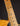 Close-up of a guitar neck with frets and strings on a dark background