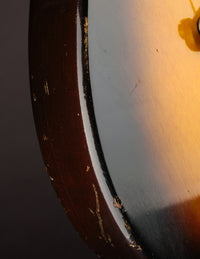 Close up of an electric guitar with sunburst finish