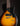 Vintage electric guitar with sunburst finish and black pickguard on a dark background