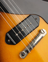 Close-up of a guitar's bridge and strings 