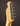 Close-up of a guitar headstock with tuning pegs on a dark background