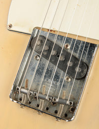 Close-up of a guitar bridge with strings 