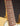 Close-up of a guitar neck and body on a dark background