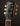 Gibson Les Paul guitar headstock with brand name on a dark background