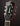 Guitar headstock with 'Guild' branding on a dark background
