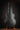 Black guitar case on a wooden stand against a dark background