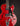 Red electric guitar with Guild logo on a black background
