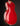 Red electric guitar on a black background, back view 