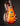 Electric guitar with a sunburst finish on a dark background