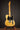 1953 Fender Telecaster guitar on a stand against a dark background