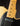 Close-up of neck and pickup on a Blonde 1953 Fender Telecaster against a dark background