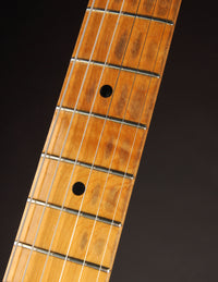 Close-up of a guitar fretboard with frets and strings on a Blonde 1953 Fender Telecaster