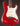 1964 candy apple red Fender Stratocaster electric guitar with a worn finish on a dark background