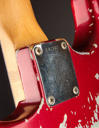 Close up of neck plate on a 1964 candy apple red Fender Stratocaster 