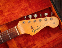 Fender Stratocaster guitar headstock in original case with orange lining