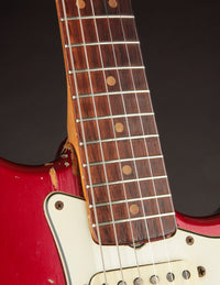 Close-up of neck on a 1964 candy apple red Fender Stratocaster 