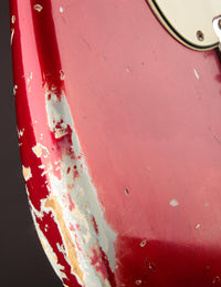 Close up of finish wear on a 1964 candy apple red Fender Stratocaster 