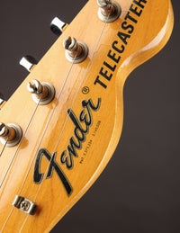 Close-up of the logo on a 1968 Fender Telecaster Custom guitar headstock