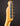 Close-up of a guitar headstock with tuning pegs on a dark background