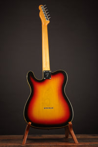Close-up of a Sunburst 1968 Fender Telecaster Custom guitar headstock on a dark background, back view 