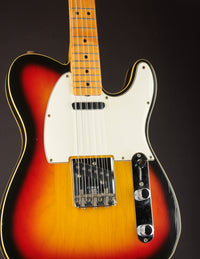 Sunburst Telecaster Custom electric guitar  on a dark background