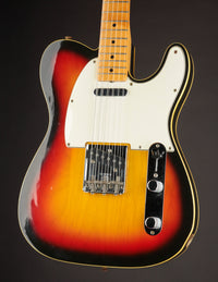 1968 Fender Telecaster electric guitar with a sunburst finish on a black background