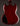 Back view of a red electric guitar on a dark background